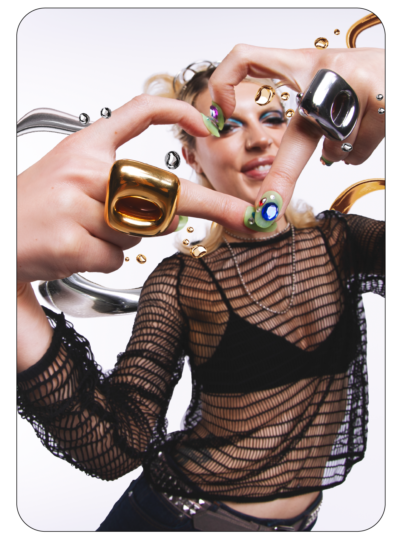 Model framing her face with jewelled hands